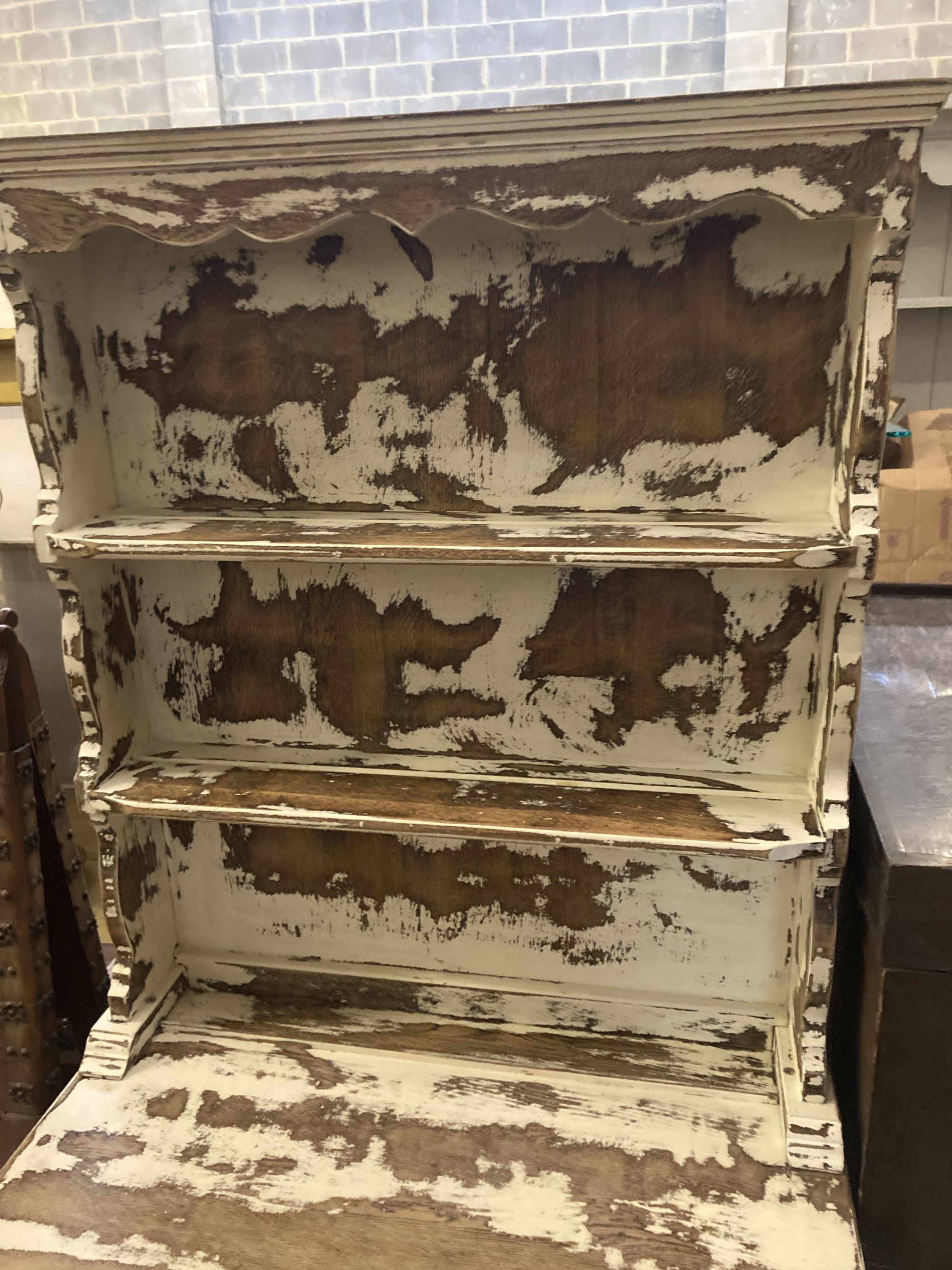 A 1920s oak narrow dresser with distressed paintwork, width 76cm, depth 42cm, height 175cm